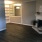 Living & Dining Room Featuring Fireplace & Faux Wood Flooring