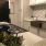 Apartment Kitchen with Farmhouse Sink & Modern Backsplash
