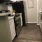 Kitchen with Espresso Faux Wood Flooring & White Cabinets