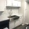 Kitchen with Modern Backsplash & White Cabinets